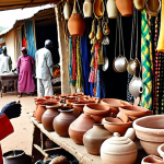 Dembé Market, N'Djamena**

"A bustling, vibrant scene at Dembé Market in N'Djamena, Chad. Focus on the colors, sounds, and smells of the market. Show artisans at work, people sampling local specialties, and merchants haggling. Capture the labyrinthine feel of the market. Include handcrafted leather goods, intricate pottery, delicate silver jewelry, and brightly colored fabrics."

**